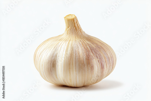 Garlic bulb with papery skin and natural texture isolated on white background, fresh ingredient for cooking and flavorful seasoning