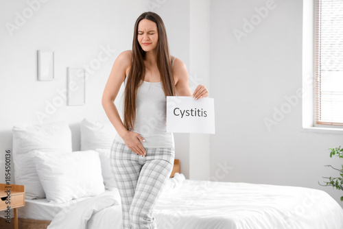 Young woman holding paper w...