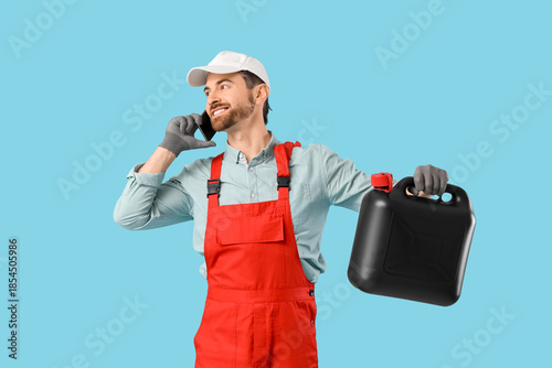 Male mechanic with canister...