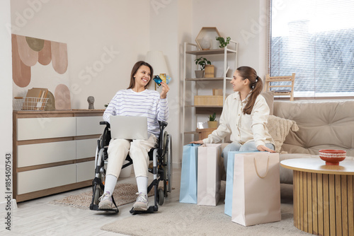 Young woman in wheelchair w...