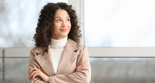 Young businesswoman looking...