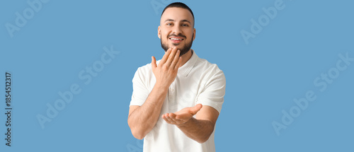 Young man using sign langua...