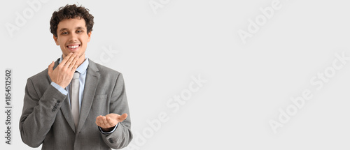 Young businessman using sig...