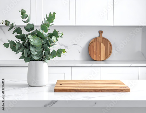 Clean kitchen interior with white marble countertop, wooden cutting board, and eucalyptus leaves in a vase. Generative AI