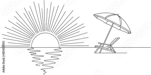 Sunrise over the ocean with a beach chair and umbrella