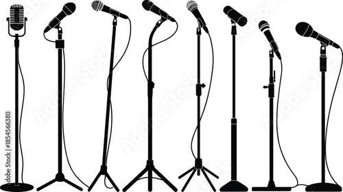 Seven Black Microphone Stands with Different Microphones on White Background