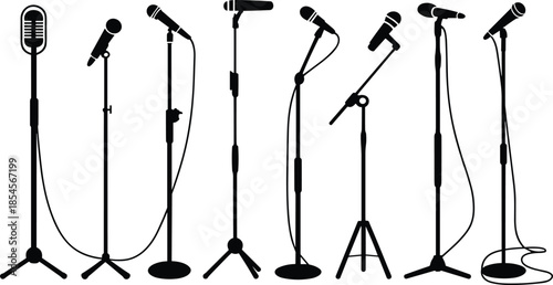 Seven different types of microphones on stands in black and white