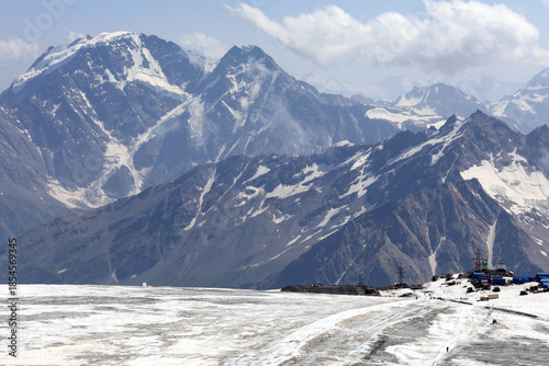 Panoramic view of Mount Elbrus covered in snow with base camp