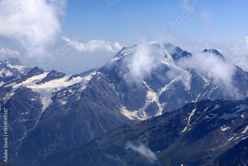Panoramic view of Mount Elbrus covered with snow and clouds