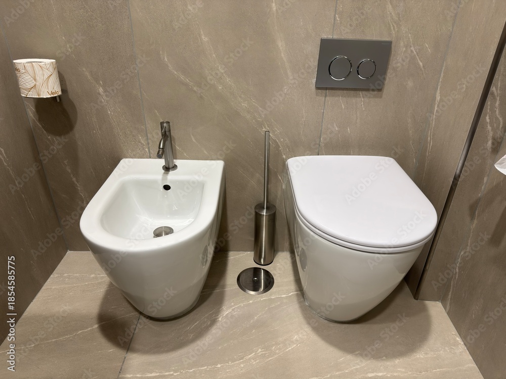 Fototapeta premium Close-up view of a modern bidet in a contemporary bathroom, emphasizing cleanliness, hygiene, and interior details.
