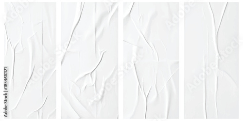 A set of four blank white crumpled paper textures with creases and folds