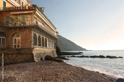 Stone building, construction on the seashore. Traditional Italian architecture. Nature on a sunny day. Background for design.