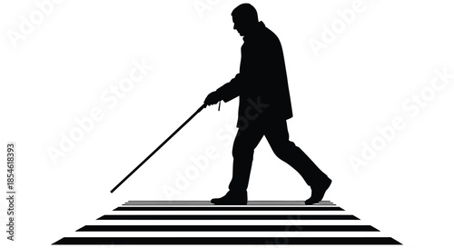 a man with a cane walking across a pedestrian crossing depicted in a striking silhouette