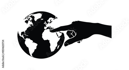 A hand gently reaching towards a detailed globe showcasing the world in a striking silhouette