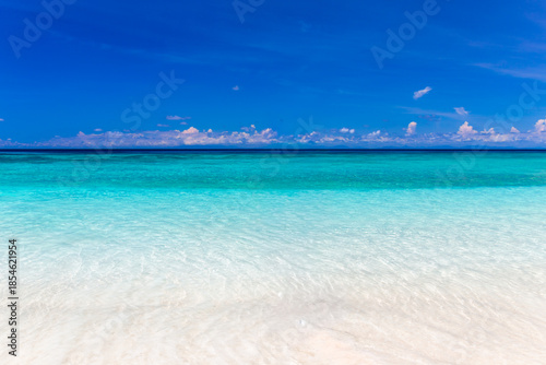 Crystal clear turquoise waters, fine white sand beaches, and a beautiful sky at Koh Tachai in the Andaman Sea, Thailand.