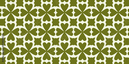 A seamless green and white pattern design featuring floral motifs and symmetrical shapes