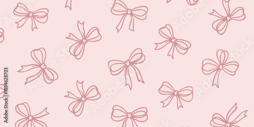 A collection of elegant red bows arranged in a seamless pattern on a soft pink background viewed from directly above