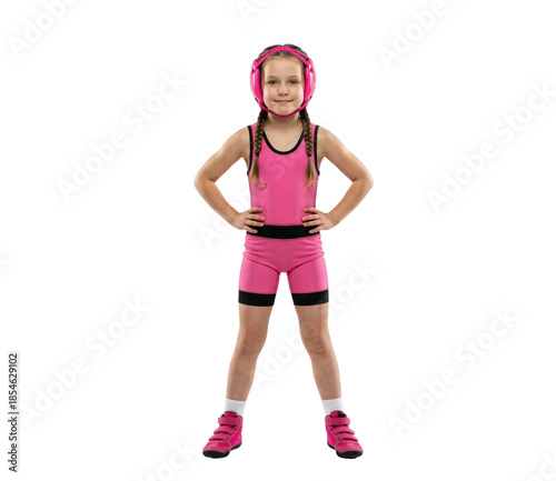 Confident young girl wrestler in pink uniform and headgear standing isolated on white background