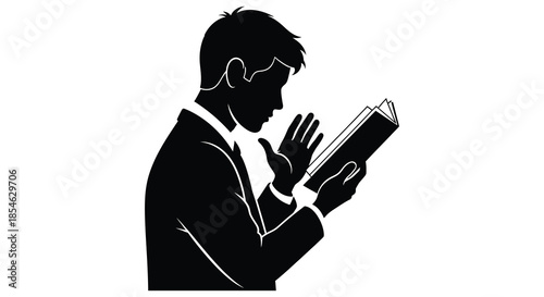 A man in a suit reading a book hands clasped in contemplation dramatic silhouette