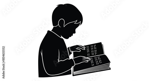A young boy intently focused while reading an open book detailed black silhouette