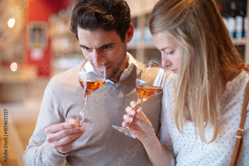 Vászonkép close up portrait of a couple tasting wine