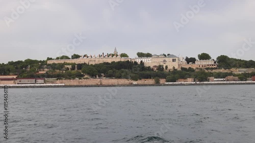 Historic buildings of Hagia Sophia and Topkapi Palace on a hillside overlooking water in Istanbul.