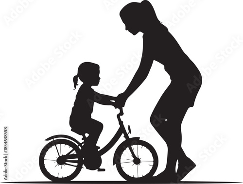 Silhouette of teaching child to ride bicycle learning