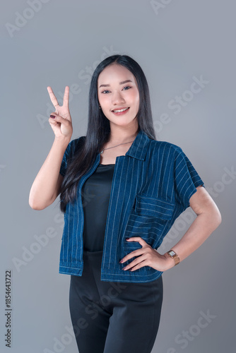 Indonesian Woman Showing Peace Sign with Confident Smile
