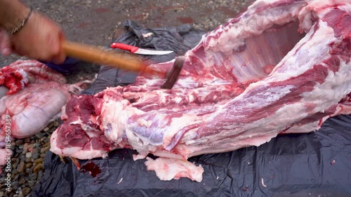 butcher cutting pork meat traditionally. 4k video.