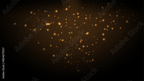 Golden stardust and glowing bokeh particles on dark background for elegant luxury design and festive holiday celebration themes