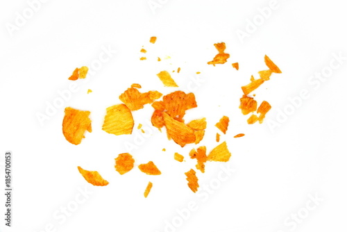 Potato chips crumbs and leftovers isolated over the white background