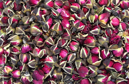 Dried Rose Buds. Dried red or pink rose buds. Natural dried rose tea isolated on white background  