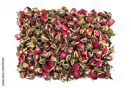 Dried Rose Buds. Dried red or pink rose buds. Natural dried rose tea isolated on white background  