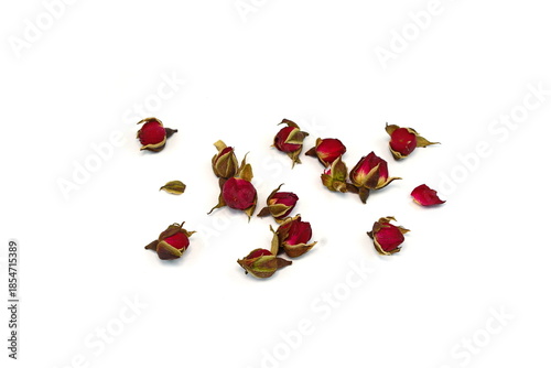 Dried Rose Buds. Dried red or pink rose buds. Natural dried rose tea isolated on white background  