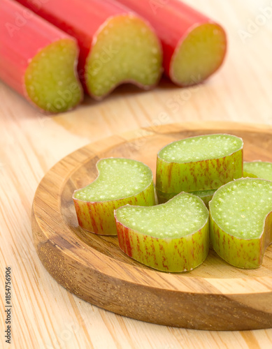 Raw Rhubarb Pieces Cut into Rounds Ready for Cooking on Board
