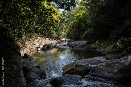 A mountain river and waterfall in a wild forest in the Hua Hin region of Thailand.