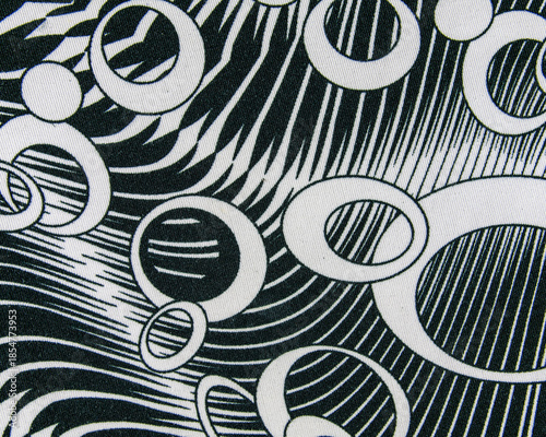 Retro black and white abstract pattern with circles and lines artistic textile texture evoking a vintage graphic design aesthetic