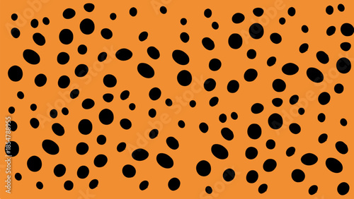 Wild cheetah fur pattern background with black spots on orange.