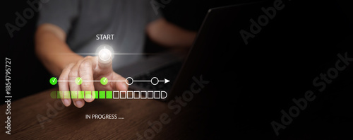 Fotografia Man with laptop pressing start button with digital progress bar showing task completion stages, project workflow, process tracking, loading status, productivity, and business management concept