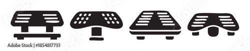 Four black stylized industrial foot pedals are arranged horizontally, showcasing various designs for operational control and mechanical interaction.