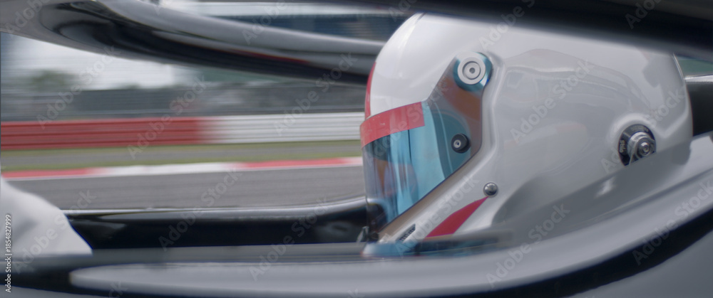 Fototapeta premium A close-up of a race car driver in motion, captured while speeding on a track