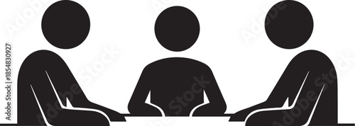 Three people sitting at a table in a meeting or discussion