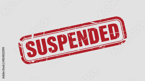 Red grunge rubber stamp with the word suspended.