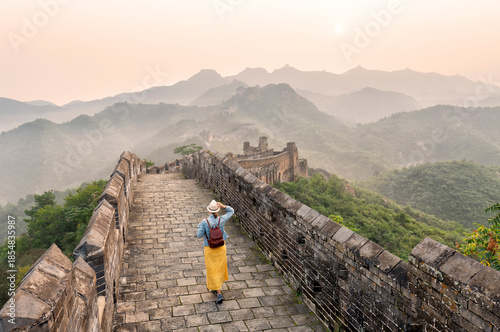 A young tourist is all alone at the Mutianyu Great Wall of China