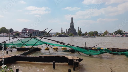 Bangkok, Thailand, 21st December 2025: Aerial shot of Chao Phraya River and Wat Arun temple