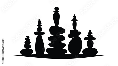 Serene stacked stones creating a balanced, peaceful silhouette against a bright background.