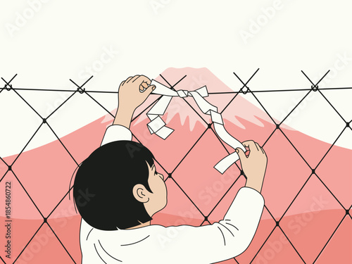 A child carefully tears paper to create a mountain silhouette against a fence, symbolizing hope and resilience. A poignant, symbolic image.