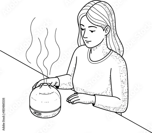 Woman using an essential oil diffuser