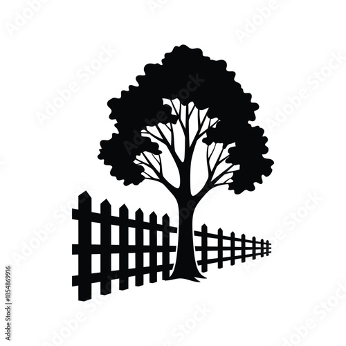 A dark tree and picket fence stretch into the distance a striking silhouette