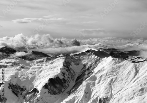 Black and white winter mountains in mist